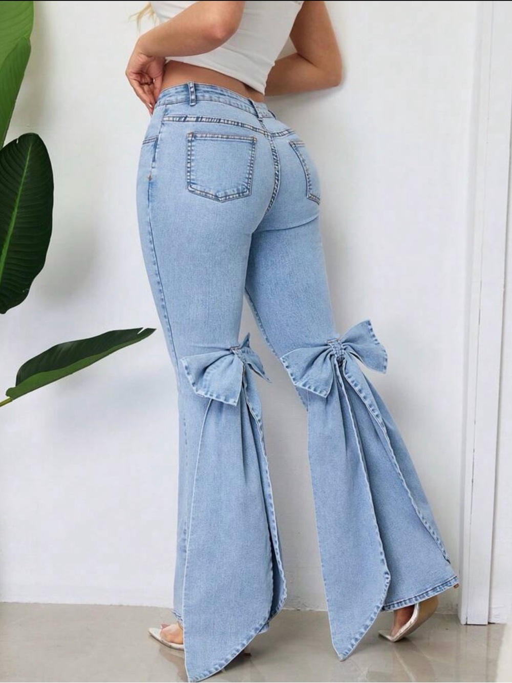 Light Blue High-Waist Flared Jeans with Bow Detail - Women's